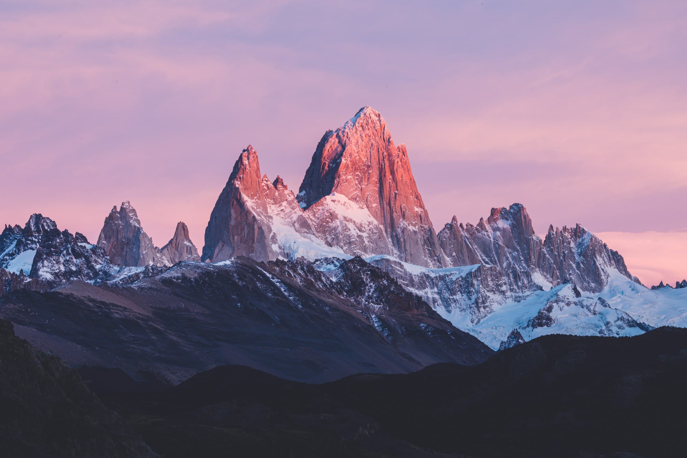 The granite spires of Mount Fitz Roy glowing pink at sunrise, Patagonia